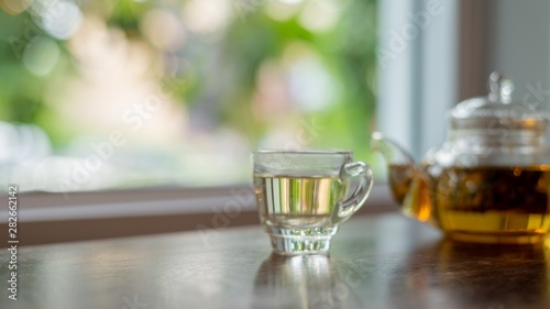 hot tea on wood table, a cup of tea