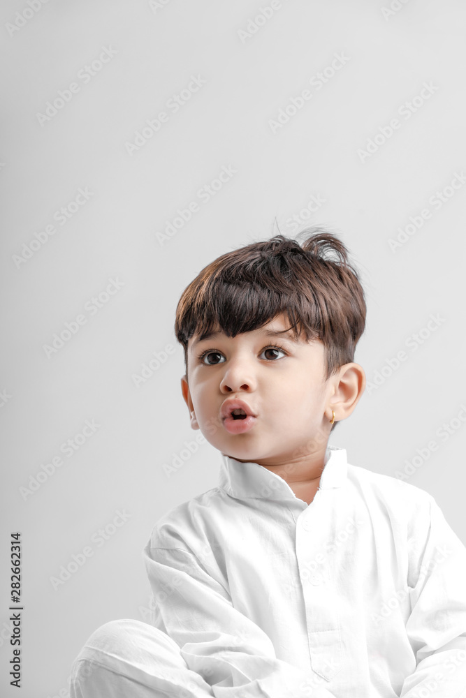 Indian little boy in Traditional Wear and Showing multi pal expression Indian little boy in Traditional Wear and Showing multi pal expression