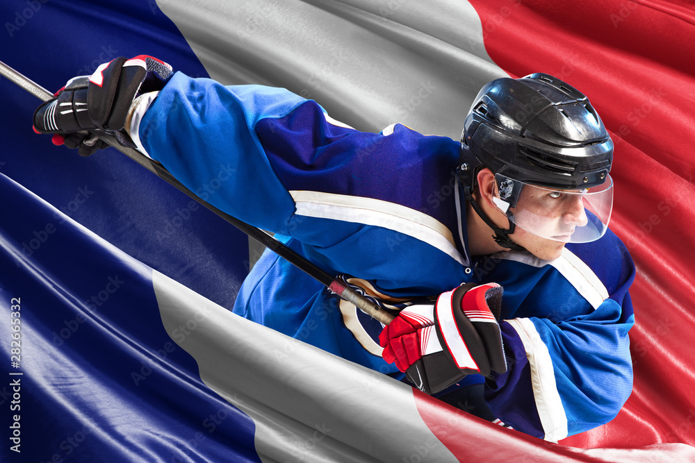 Fototapeta premium France Hockey Player in action around national flags