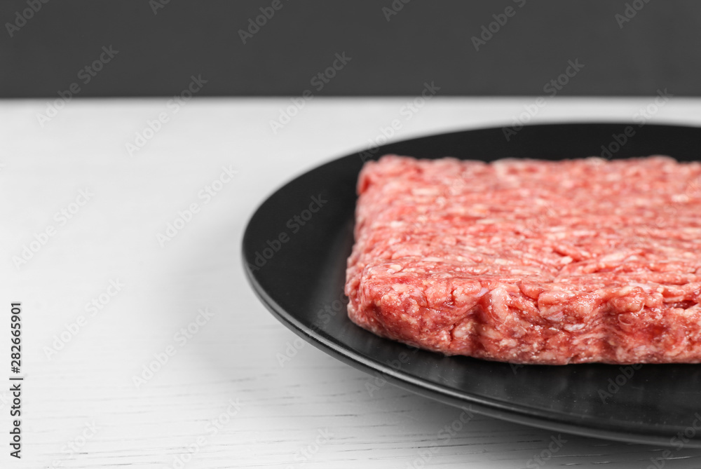 minced beef on white wood background. Close up minced beef on white wood background. Close up