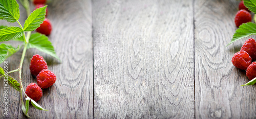  Raspberry, organic raspberries on rustic wooden table