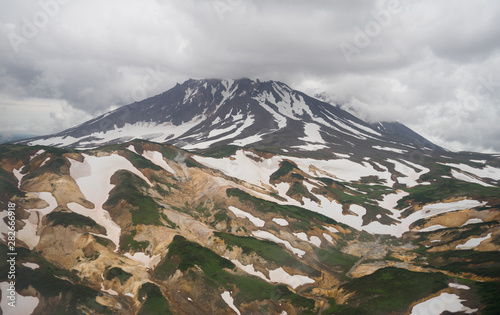 Aerial view of the volcanic slopes between Petropavlovsk-Kamchatsky and Kronotsky Nature Reserve. Complex pattern on slopes created by geothermal waters and fumarolic activity. Kamchatka, Russia photo