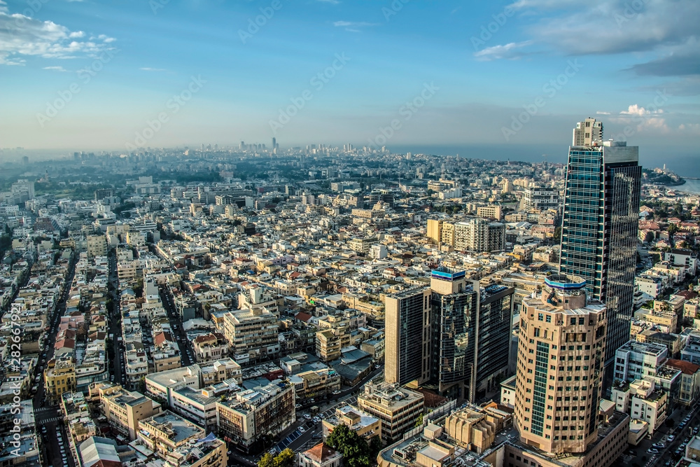 Obraz premium construction site with working cranes on blue sky background