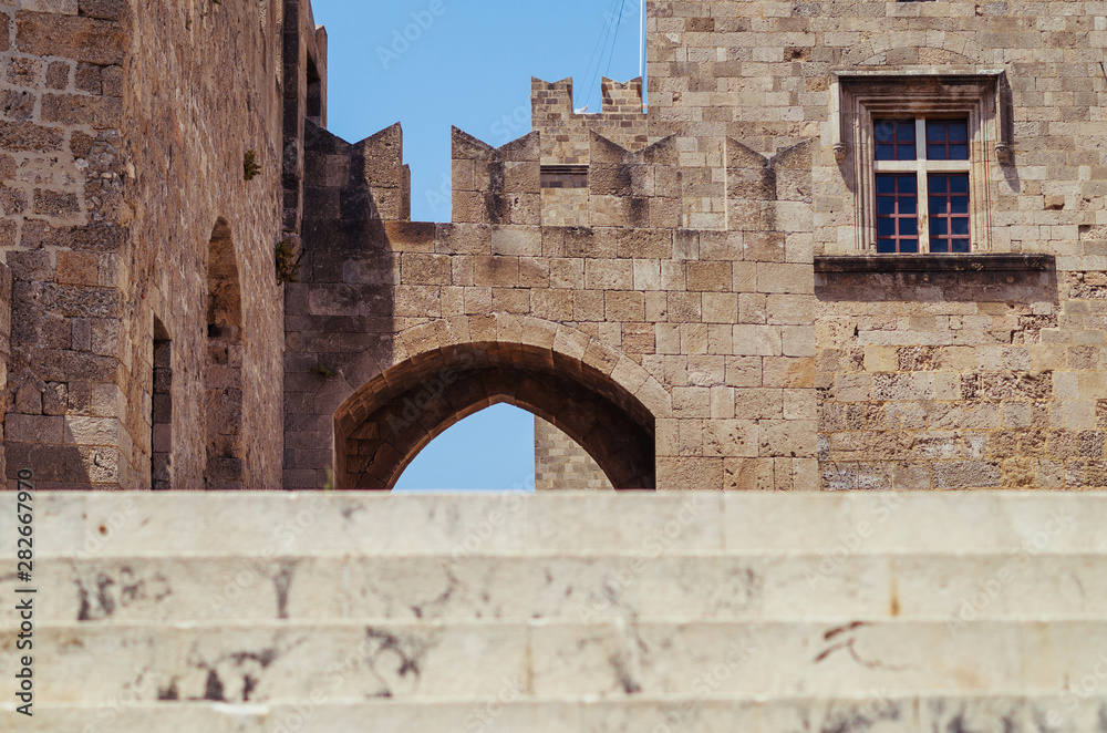 Unusual view of an old town in Rhodes. Stairs leading to the medieval part of Rhodes in Greece