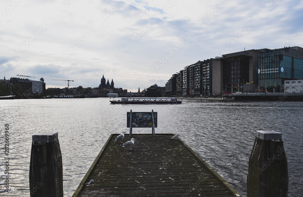 Fototapeta premium Wooden pier in a cloudy day