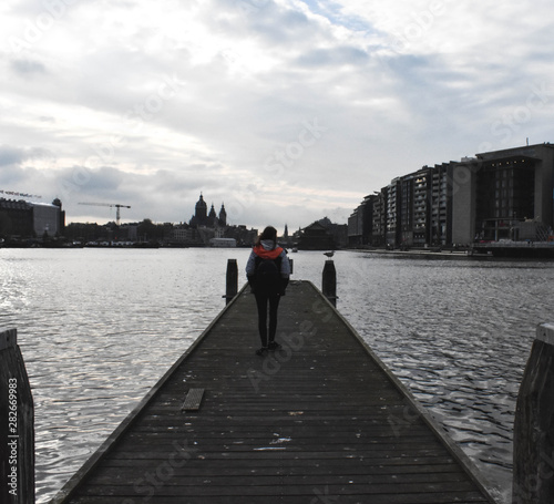 Girl walking on a pier