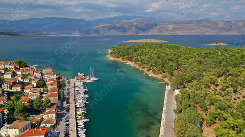 Aerial drone photo of famous seaside area and forest of Kentri in picturesque village and port of Galaxidi, Fokida, Greece