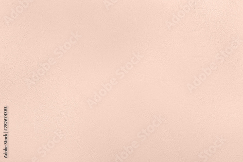 Pale pink colored low contrast Concrete textured background with roughness and irregularities