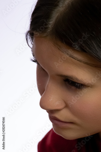 Portrait of a young girl on a white background