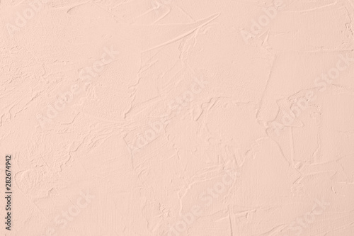 Pale pink colored low contrast Concrete textured background with roughness and irregularities. Autumn Winter 2020 color trend.