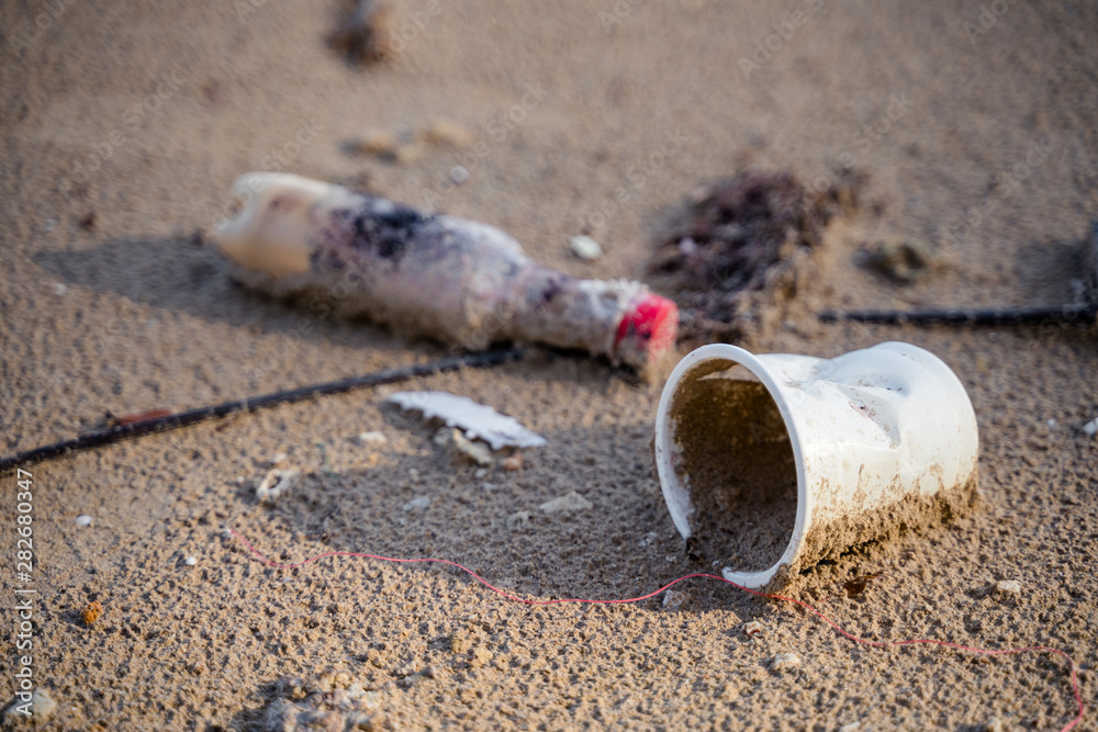 Closeup Many pieces of waste on the Beach . Closeup Many pieces of waste on the Beach .