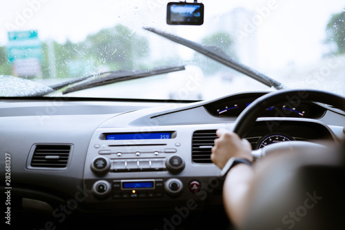 Safe drive on rainy day, speed control and security distance on the road, driving safely