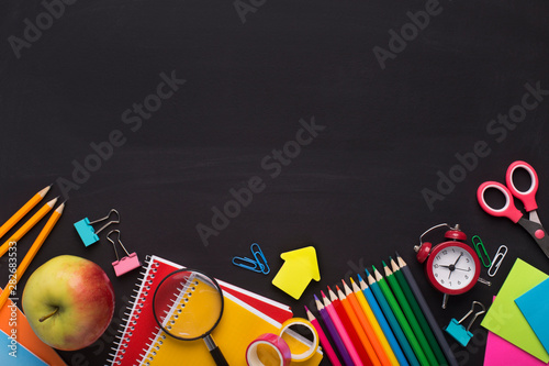 Blank space and Colored School stationery placed on chalk board