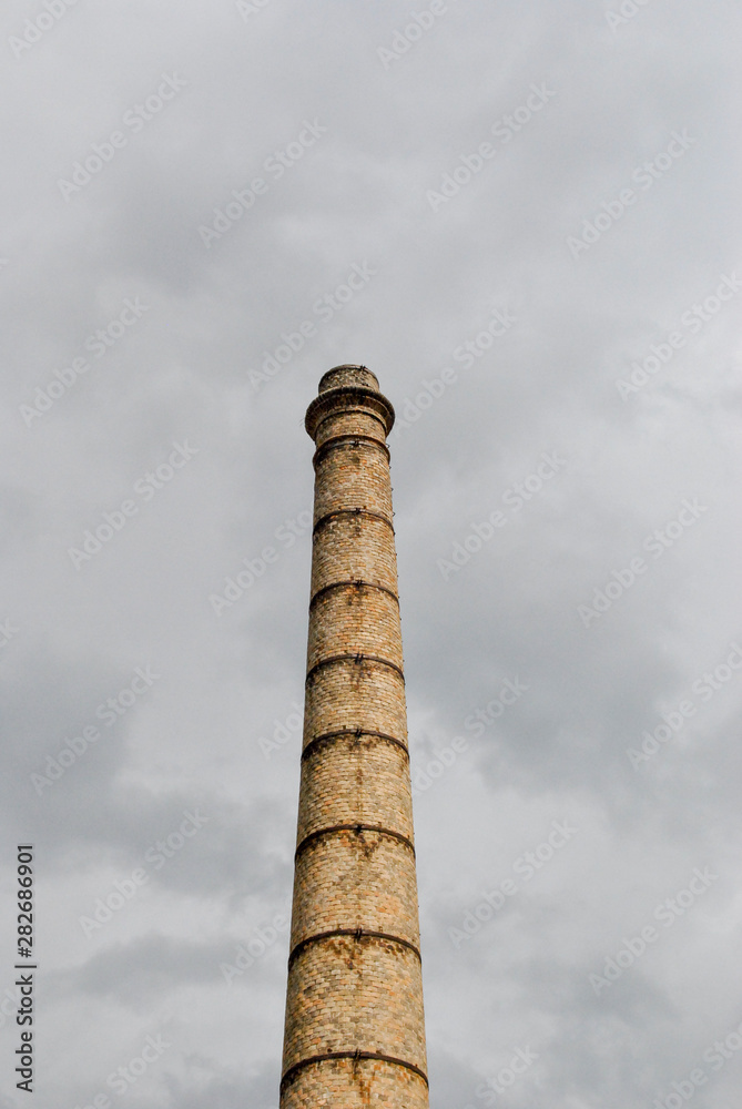 old chimney tower in a village in Italy