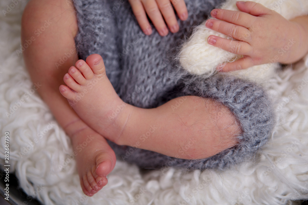 Newborn baby boy, sleeping peacefully in basket, dressed in knitted outfit, Newborn baby boy, sleeping peacefully in basket, dressed in knitted outfit,