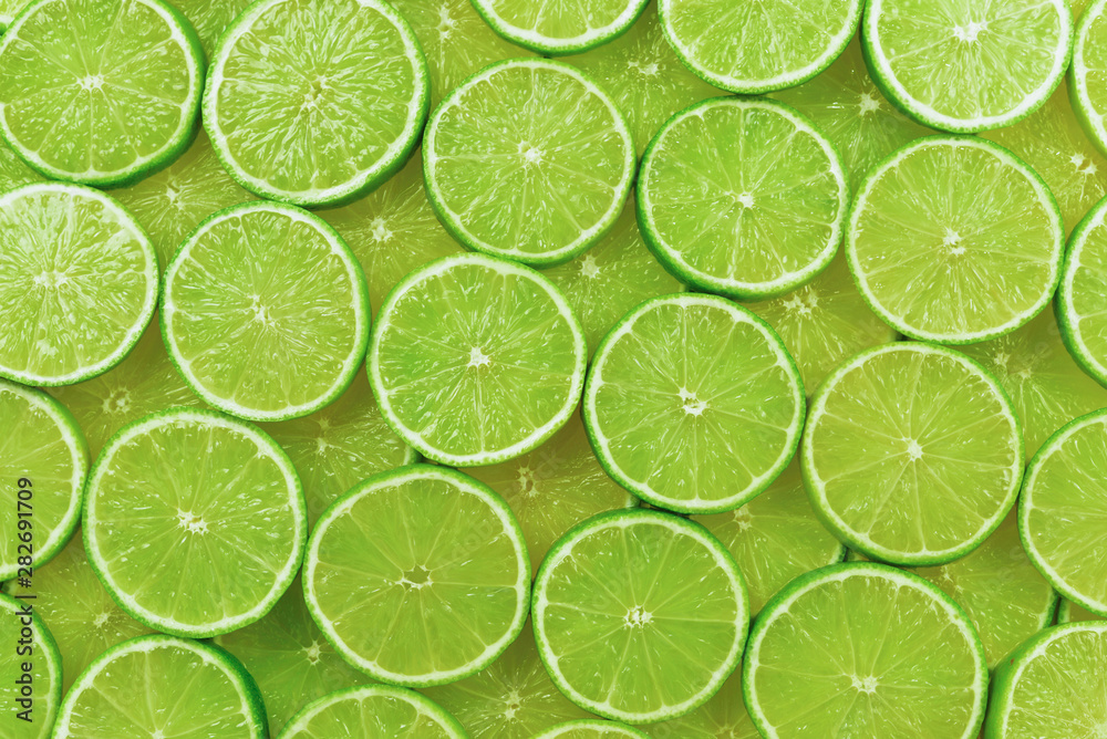 Fresh lime slices as a background.