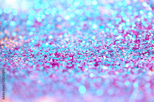 Gold (bronze) glitter shine dots confetti. Abstract light blur blink sparkle defocus background.