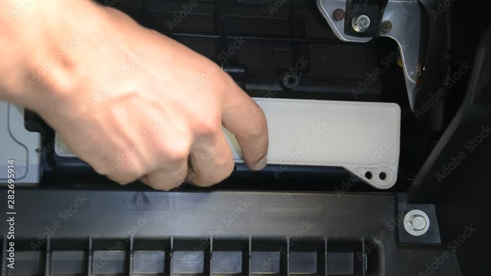 Car repair wizard changes cabin filter in car