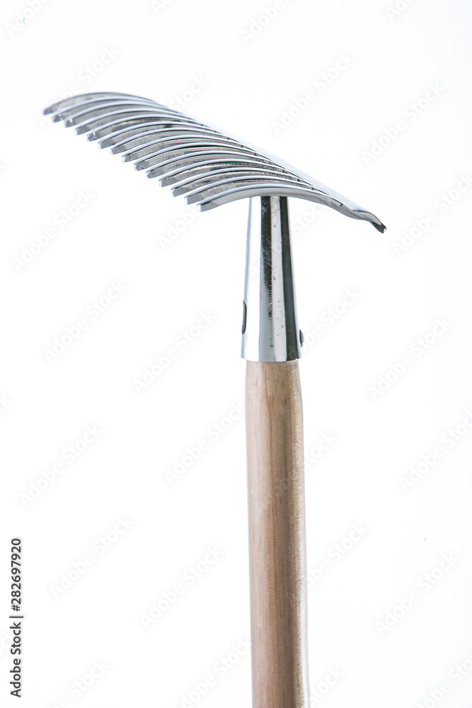 Steel rake on a white background Steel rake on a white background
