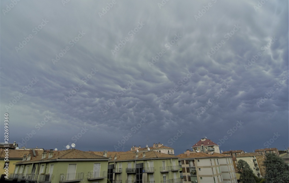 Dark rainy clouds over the Milano city