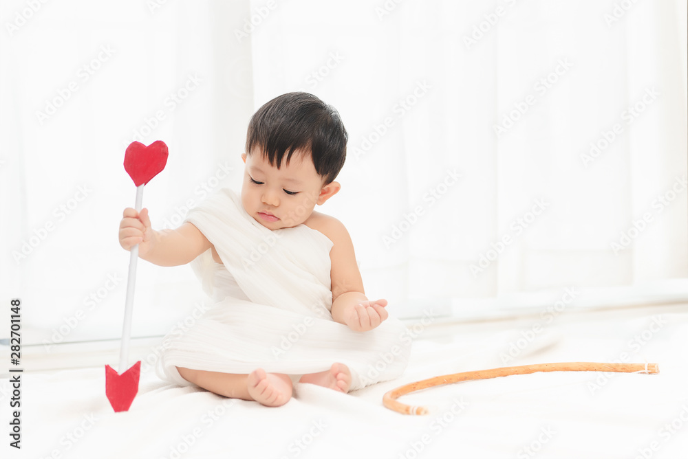 Cupid funny, Little asian boy with Cupid costume and wings for Valentine's festival day. Cupid funny, Little asian boy with Cupid costume and wings for Valentine's festival day.