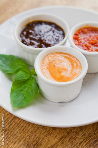 Sauces and dips colection -  spicy fresh chlili sriracha sauce, sundried tomato mayonnaise and smokey sweet rich bbq sauce.