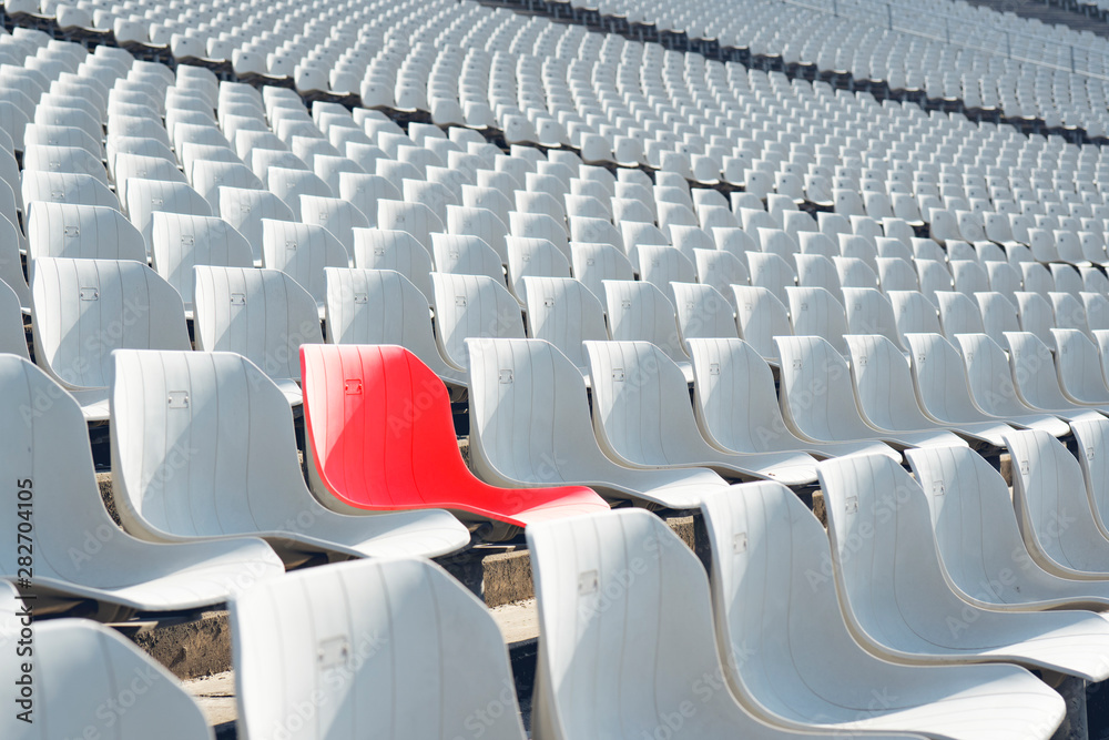 Fototapeta premium Red seat in White seats on the stadium
