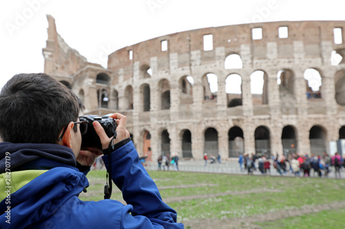 while photographer takes a picture of the famous Roman amphithea photo