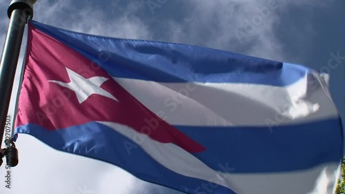 Cuba flag waving in breeze-close up-sunny day-blue sky-Miami-Calle Ocho-SW 8th Street-Cuban-American