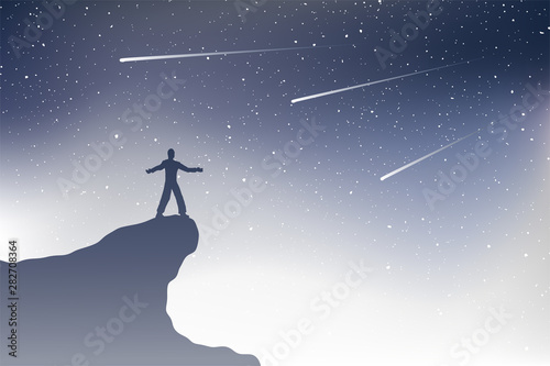 man in mountain watching shooting stars