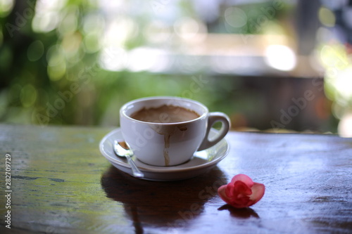 cup of coffee on wooden table