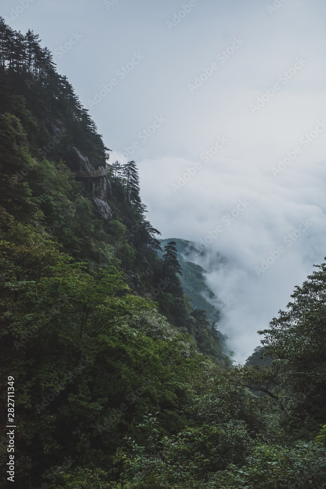 Mountain ridges in clouds, Mingyue Mountain, China Mountain ridges in clouds, Mingyue Mountain, China