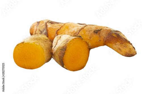 heap of turmeric slices isolated on white background photo