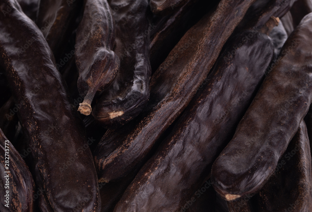 heap of carob pods  background