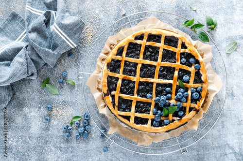 Traditional homemade american blueberry pie with lattice pastry, top view. photo