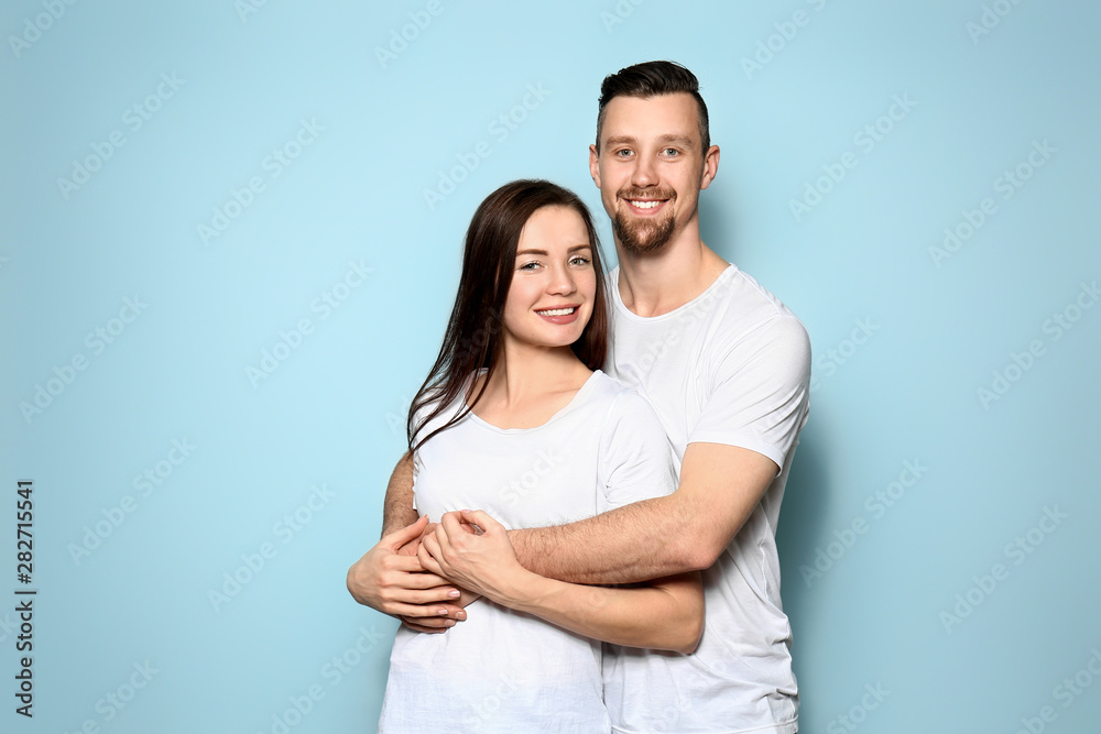 Happy young couple on color background Happy young couple on color background
