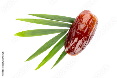 Dry dates isolated on white background. Top view. Flat lay pattern. photo