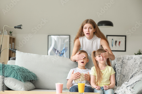 Family watching scary movie...