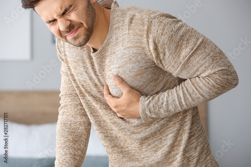 Young man suffering from he...