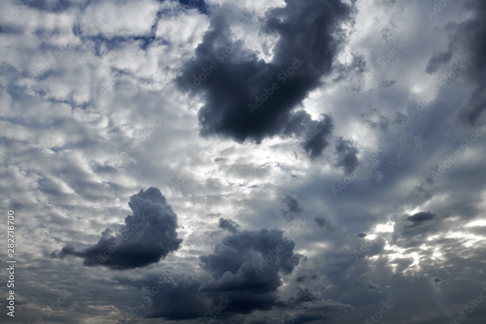 Dark blue sky with clouds for background or texture Dark blue sky with clouds for background or texture