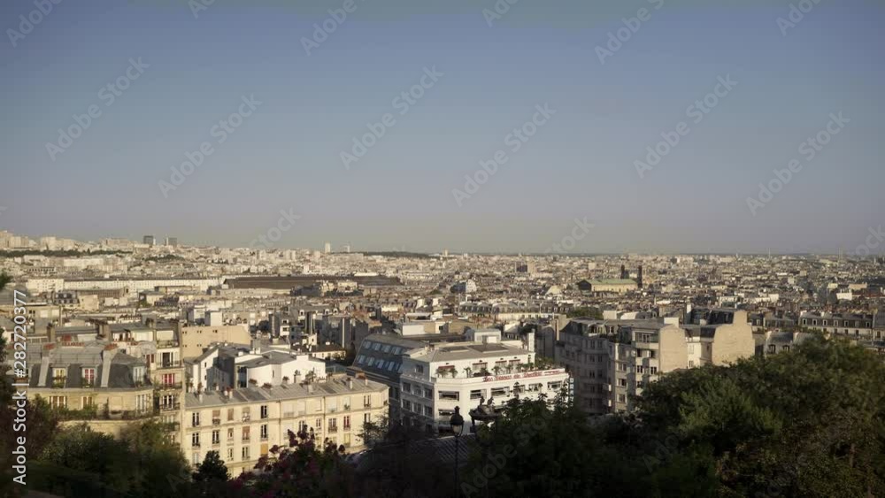 Panoramic city view of Paris, Paris on a sunny evening. France is full of beautiful buildings. Left to right pan real time establishing shot. City view Panoramic city view of Paris, Paris on a sunny evening. France is full of beautiful buildings. Left to right pan real time establishing shot. City view