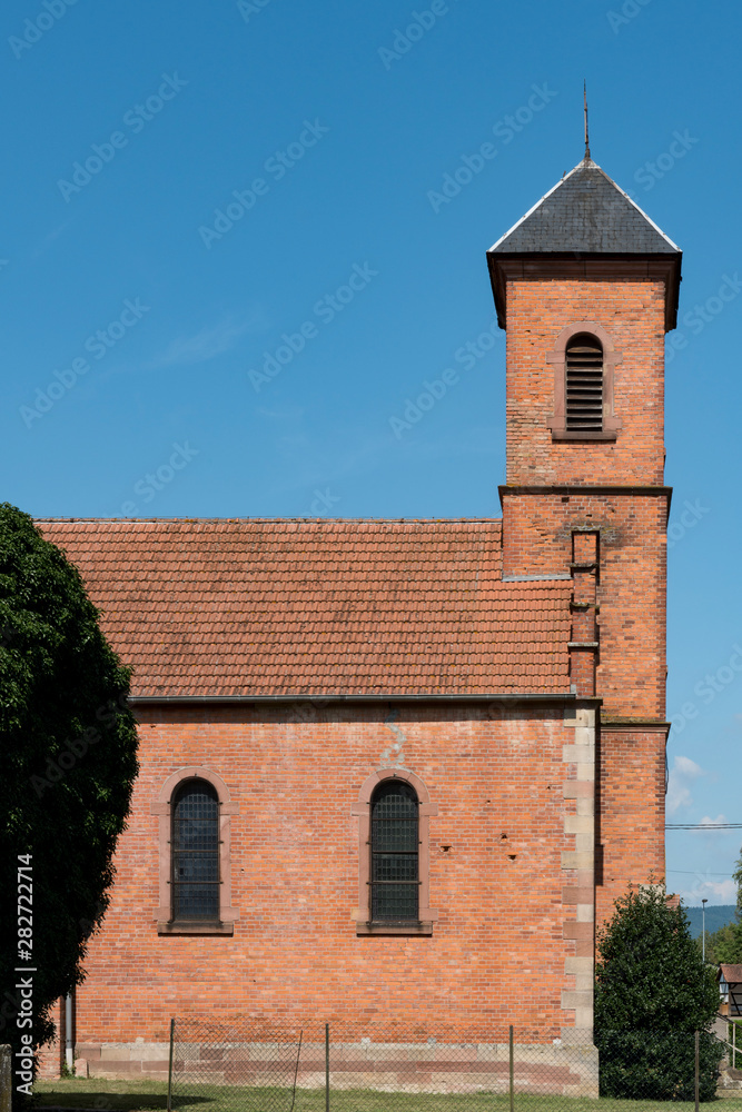 orange brick church in Ingolsheim, France