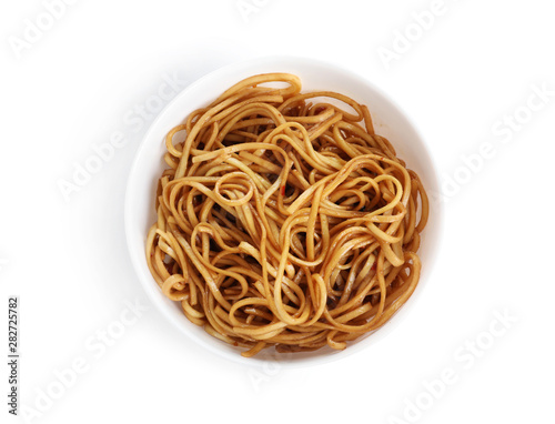 Bowl of tasty cooked noodles isolated on white