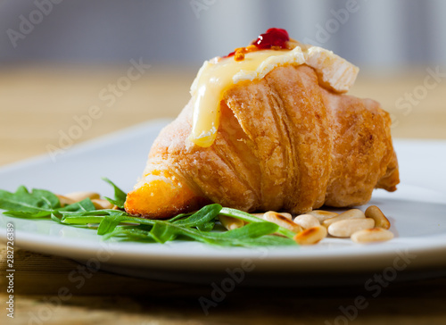 Vászonkép Mini croissant with camembert, jam, pine nuts