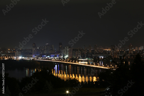 Beautiful view of bridge with illumination in modern city at night