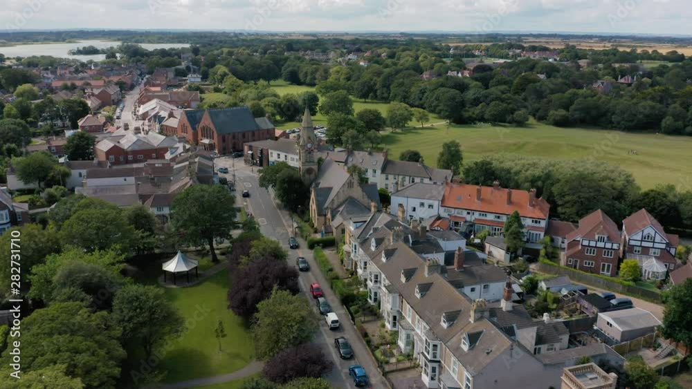 4K Aerial view of the idyllic and scenic seaside town of Hornsea. The memorial gardens and church, going towards the high street and town centre. Summer 2019 4K Aerial view of the idyllic and scenic seaside town of Hornsea. The memorial gardens and church, going towards the high street and town centre. Summer 2019