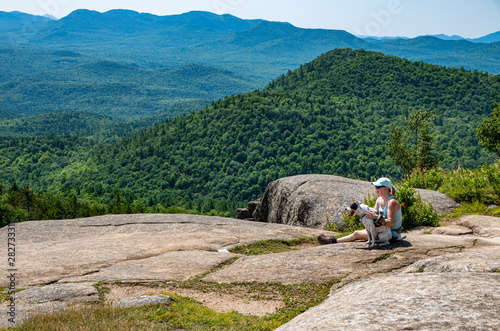 Woman and dog on Poke-O-Moonshine moutain