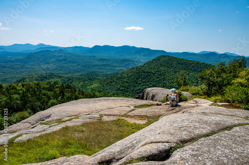 Woman and dog on Poke-O-Moonshine moutain
