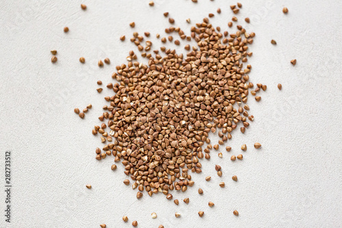 Pile of buckwheat isolated on white background. Top view.