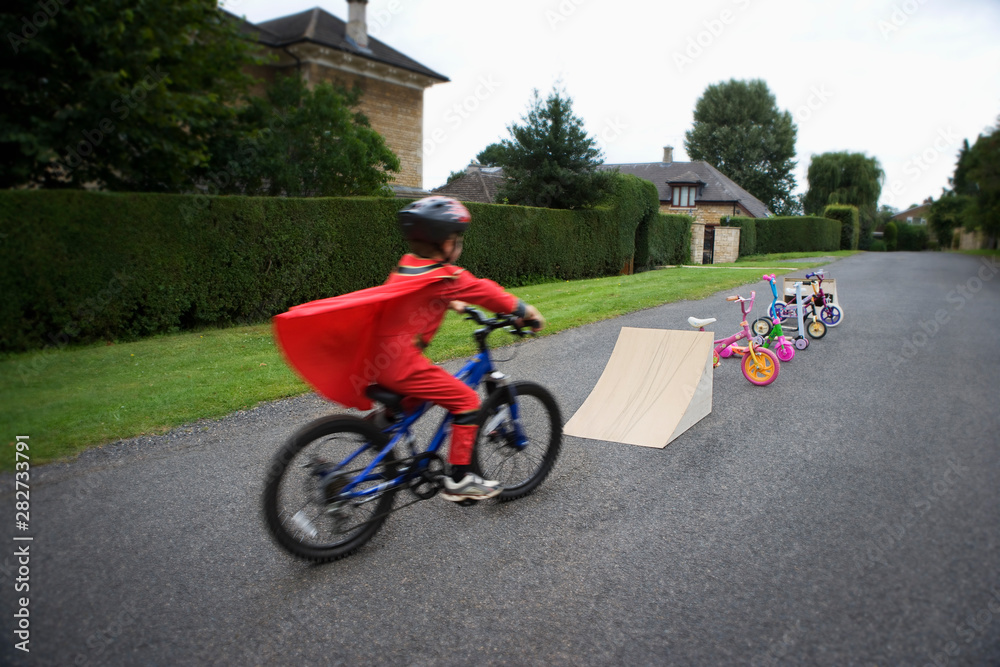 custom made wallpaper toronto digitalYoung boy riding bicycle towards ramp